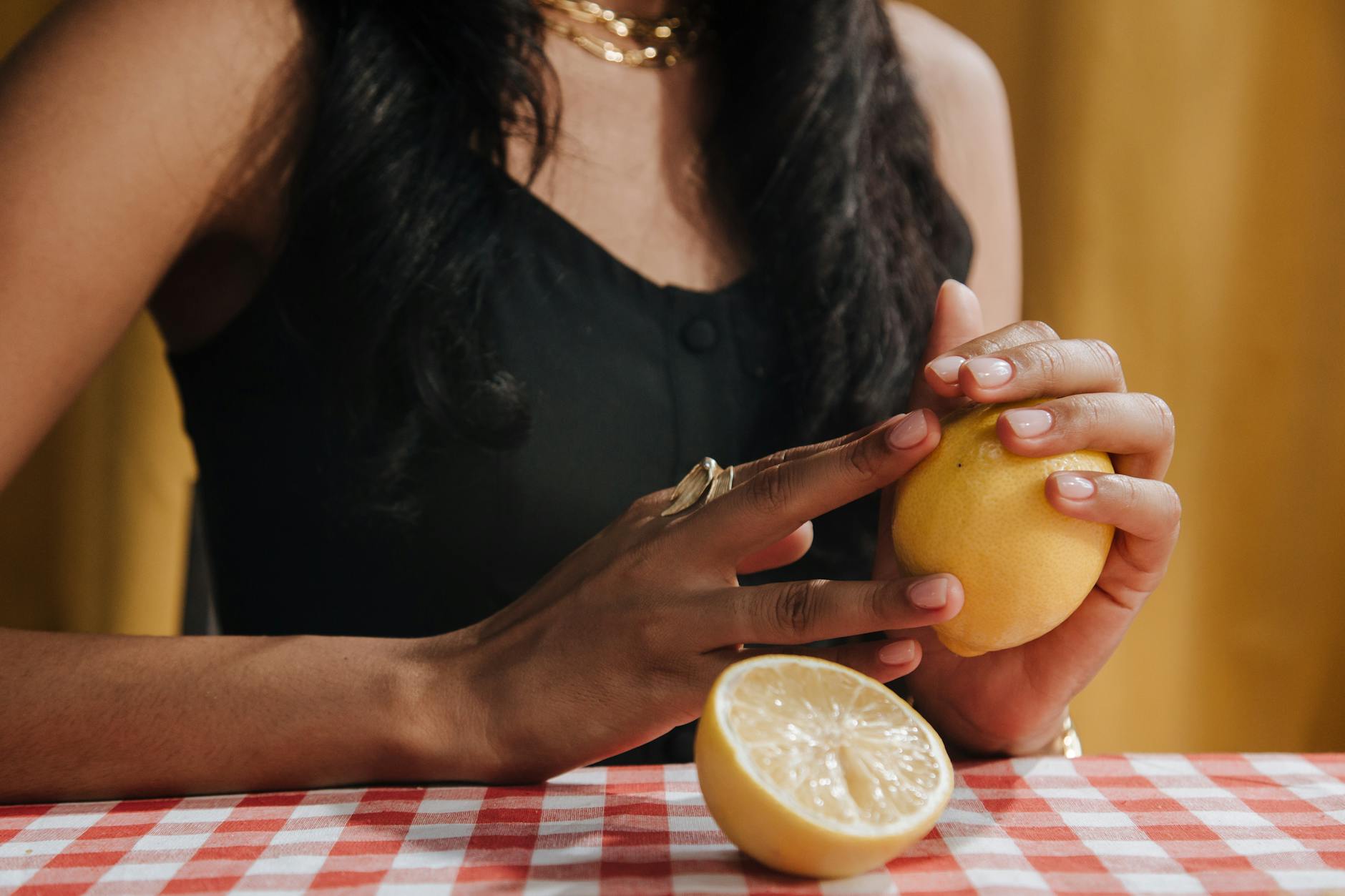 Person holding fresh lemons, symbolizing renewal and sensory reconnection