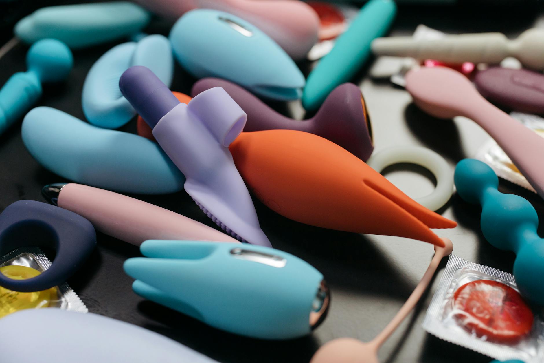 A collection of vibrant adult toys including lemon vibrators displayed in close-up.